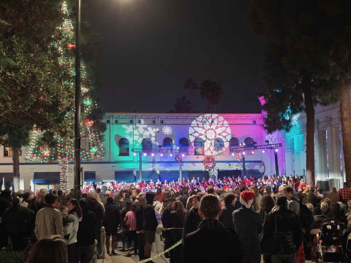 Old Town Orange Plaza fountain and tree lighting crowd on a December night