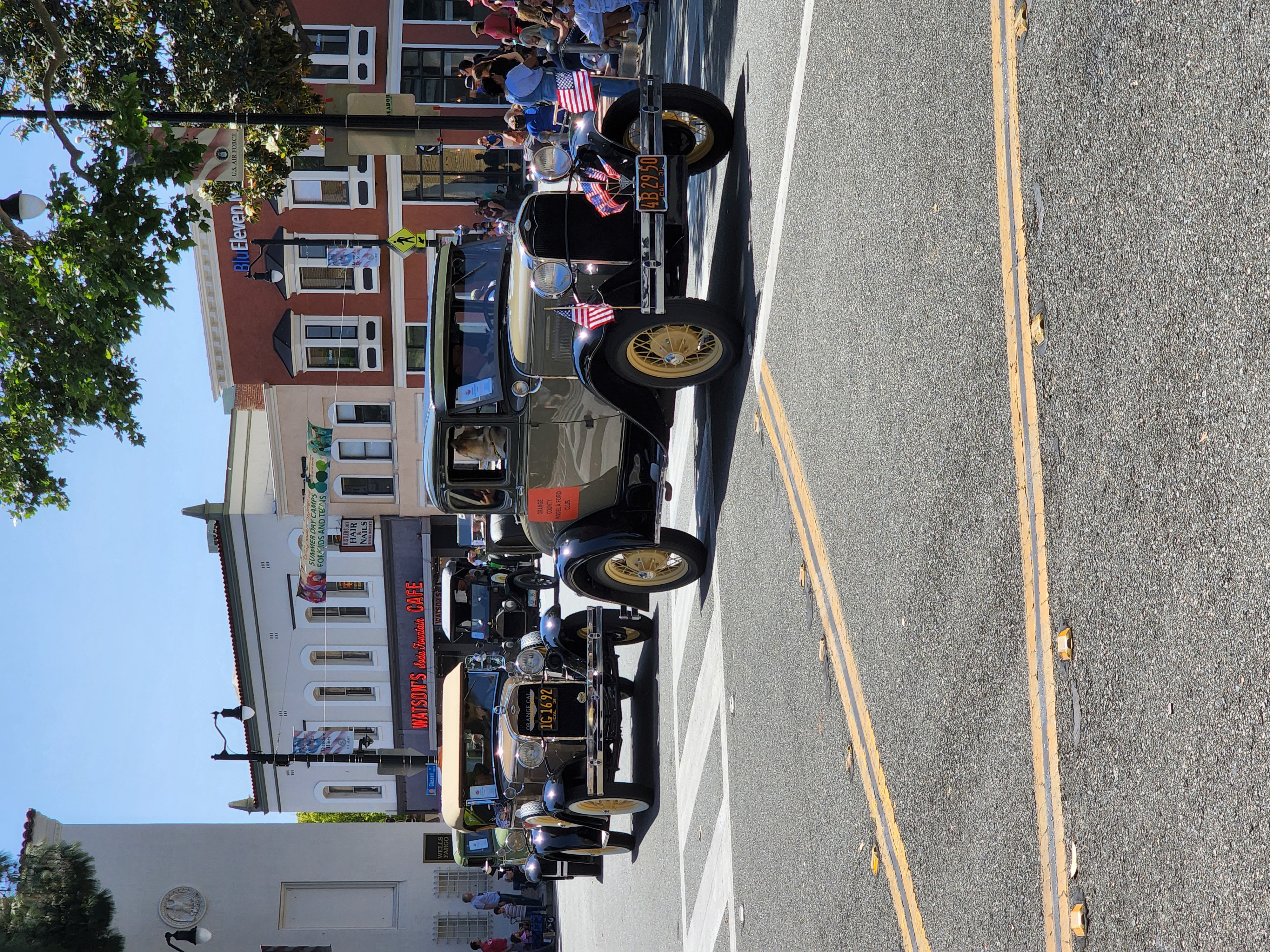 Historic Orange Circle during the annual parade, with Watson's Soda Fountain in the background